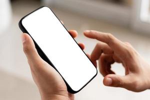 mockup copy space phone, man's hand holding smartphone with blank white copy screen for your advertising and message or information content. photo