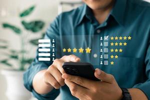 User give rating to service experience on online application, Customer review satisfaction feedback survey concept, Customer can evaluate quality of service leading to reputation ranking of business. photo