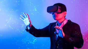 Young man wearing VR goggles. Metaverse technology virtual reality concept. Virtual Reality Device, Simulation, 3D, AR, VR, Innovation and Technology of the Future on Social Media. photo