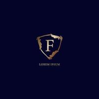 Letter F Alphabetic logo design template isolated on navy blue backgroud. Decorative floral shield sign illustration. Luxury metalic gold security logo concept. vector