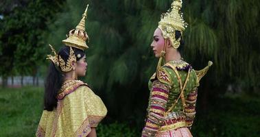 Portrait of Thai woman and man in traditional dress looking at camera.Thailand culture and thai dancing concept. video