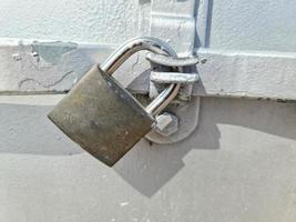 Close uo of a lock at a close metal door photo