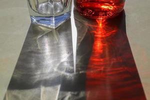 Sunlight shining through a drinking glas showing caustic light effects. photo