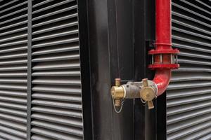 Fire fighter tool pipe. Fire department connection on footpath outside the building.Fire hydrant,standpipe separated for using in high zone for fire truck to connect supporting water photo