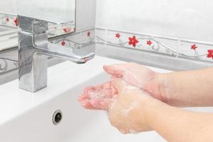 Both hands are washing their hands in the sink.Hygiene concept. photo