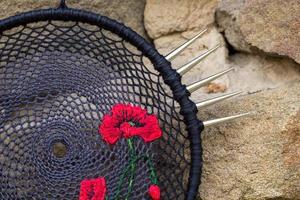 Handmade dream catcher with feathers threads and beads rope hanging photo