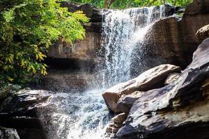 Tropical waterfall in rain forest photo