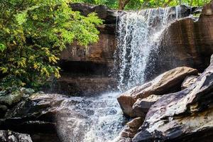 Tropical waterfall in rain forest photo