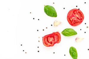food background of tomato, garlic and basil on white background. Top view photo