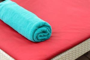 New towels on a sun-bed near a swimming pool. photo