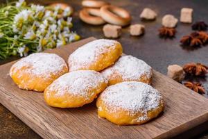 Homemade corn cookies on concrete table - healthy homemade vegan vegetarian pastry photo