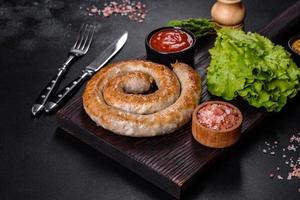 Baked homemade sausage with spices and herbs, close up photo