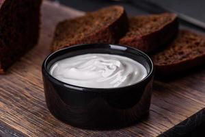 Sliced rye bread on cutting board. Whole grain rye bread with seeds photo
