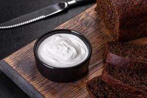 Sliced rye bread on cutting board. Whole grain rye bread with seeds photo