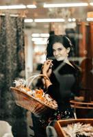 Beautiful Ukrainian girl with a basket of flowers. photo