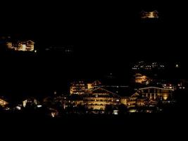 The lights of hotels standing on a slope in the Night. photo