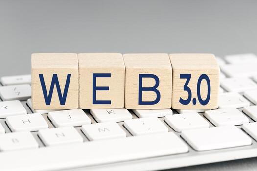WEB 3.0 word on wooden block on computer keyboard photo