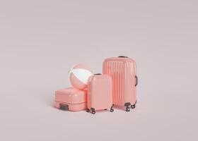 Pink suitcases and beach ball photo