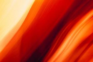 Abstraction current burning avalanche. Wavy background in red yellow orange tones. photo
