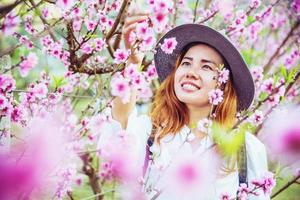 woman asian travel nature. Travel relax. photographed in a flower garden. photo