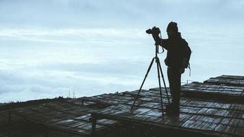 man asians travel relax in the holiday. Photograph landscape on the Moutain.Thailand photo