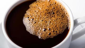 black coffee Bubbles in a cup of coffee. photo