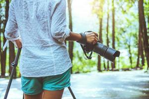 Photography asian woman travel nature. Travel relax. Nature Study. At public park in summer. National park doi inthanon in Thailand. photo