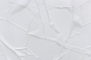 Blank white paper is crumpled texture background. Crumpled paper texture backgrounds for various purposes photo