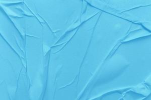Blank blue paper is crumpled texture background. Crumpled paper texture backgrounds for various purposes photo