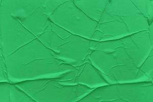 Blank green paper is crumpled texture background. Crumpled paper texture backgrounds for various purposes photo