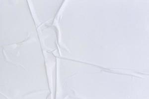 Blank white paper is crumpled texture background. Crumpled paper texture backgrounds for various purposes photo
