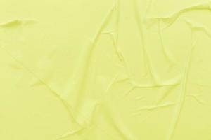Blank yellow paper is crumpled texture background. Crumpled paper texture backgrounds for various purposes photo