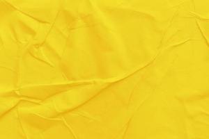 Blank yellow paper is crumpled texture background. Crumpled paper texture backgrounds for various purposes photo