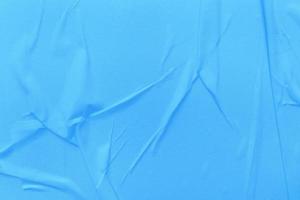 Blank blue paper is crumpled texture background. Crumpled paper texture backgrounds for various purposes photo