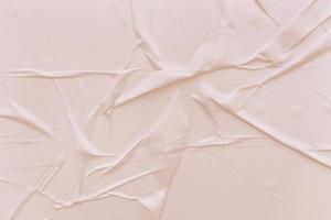 Blank cream paper is crumpled texture background. Crumpled paper texture backgrounds for various purposes photo