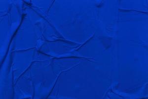 Blank blue paper is crumpled texture background. Crumpled paper texture backgrounds for various purposes photo