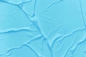 Blank blue paper is crumpled texture background. Crumpled paper texture backgrounds for various purposes photo