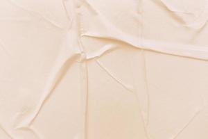 Blank cream paper is crumpled texture background. Crumpled paper texture backgrounds for various purposes photo