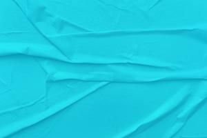 Blank blue paper is crumpled texture background. Crumpled paper texture backgrounds for various purposes photo