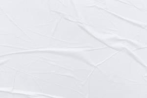 Blank white paper is crumpled texture background. Crumpled paper texture backgrounds for various purposes photo