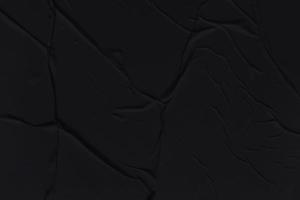 Blank black paper is crumpled texture background. Crumpled paper texture backgrounds for various purposes photo