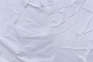 Blank white paper is crumpled texture background. Crumpled paper texture backgrounds for various purposes photo