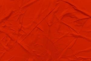 Blank red paper is crumpled texture background. Crumpled paper texture backgrounds for various purposes photo
