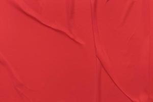 Blank red paper is crumpled texture background. Crumpled paper texture backgrounds for various purposes photo