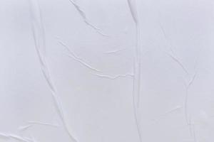Blank white paper is crumpled texture background. Crumpled paper texture backgrounds for various purposes photo