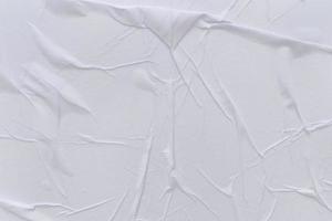 Blank white paper is crumpled texture background. Crumpled paper texture backgrounds for various purposes photo