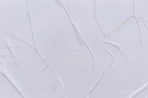 Blank white paper is crumpled texture background. Crumpled paper texture backgrounds for various purposes photo