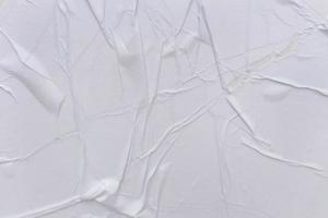 Blank white paper is crumpled texture background. Crumpled paper texture backgrounds for various purposes photo
