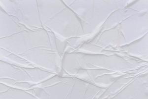 Blank white paper is crumpled texture background. Crumpled paper texture backgrounds for various purposes photo