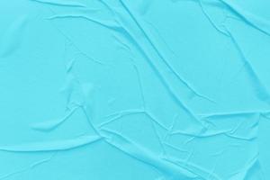 Blank blue paper is crumpled texture background. Crumpled paper texture backgrounds for various purposes photo